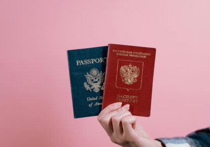 2 passport display in hand