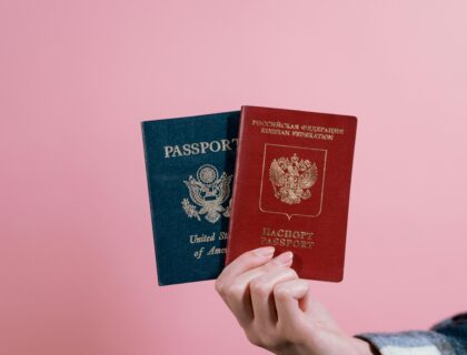 2 passport display in hand