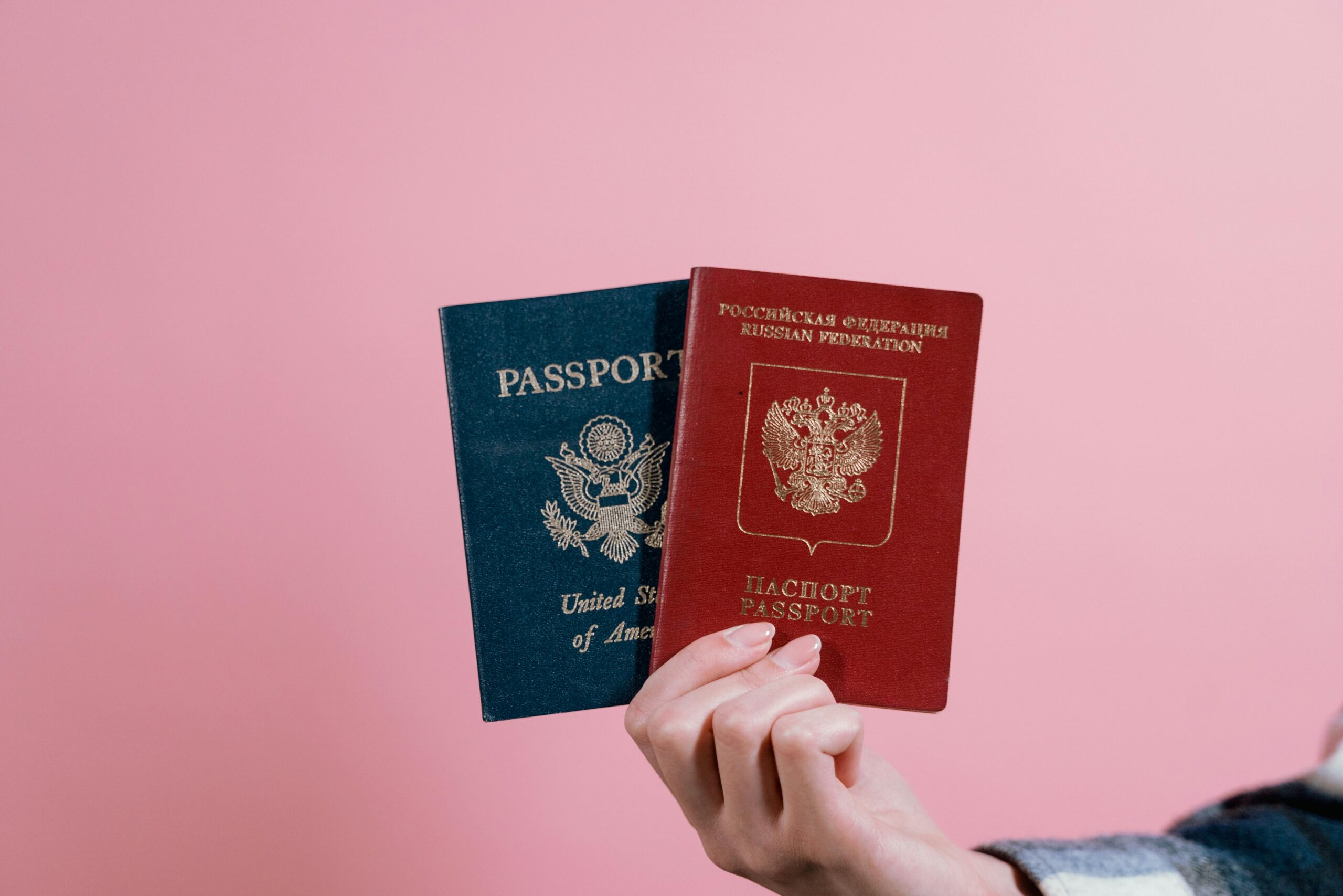 2 passport display in hand